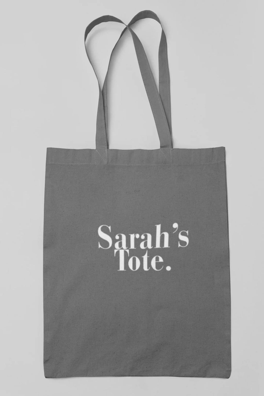 Light gray cotton tote bag with custom text "Sarah's Tote."