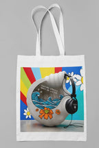 White tote bag with headphones and ocean wave graphic, tote-style front