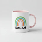 Personalised rainbow mug with name SARAH, pink handle and pink inner rim.