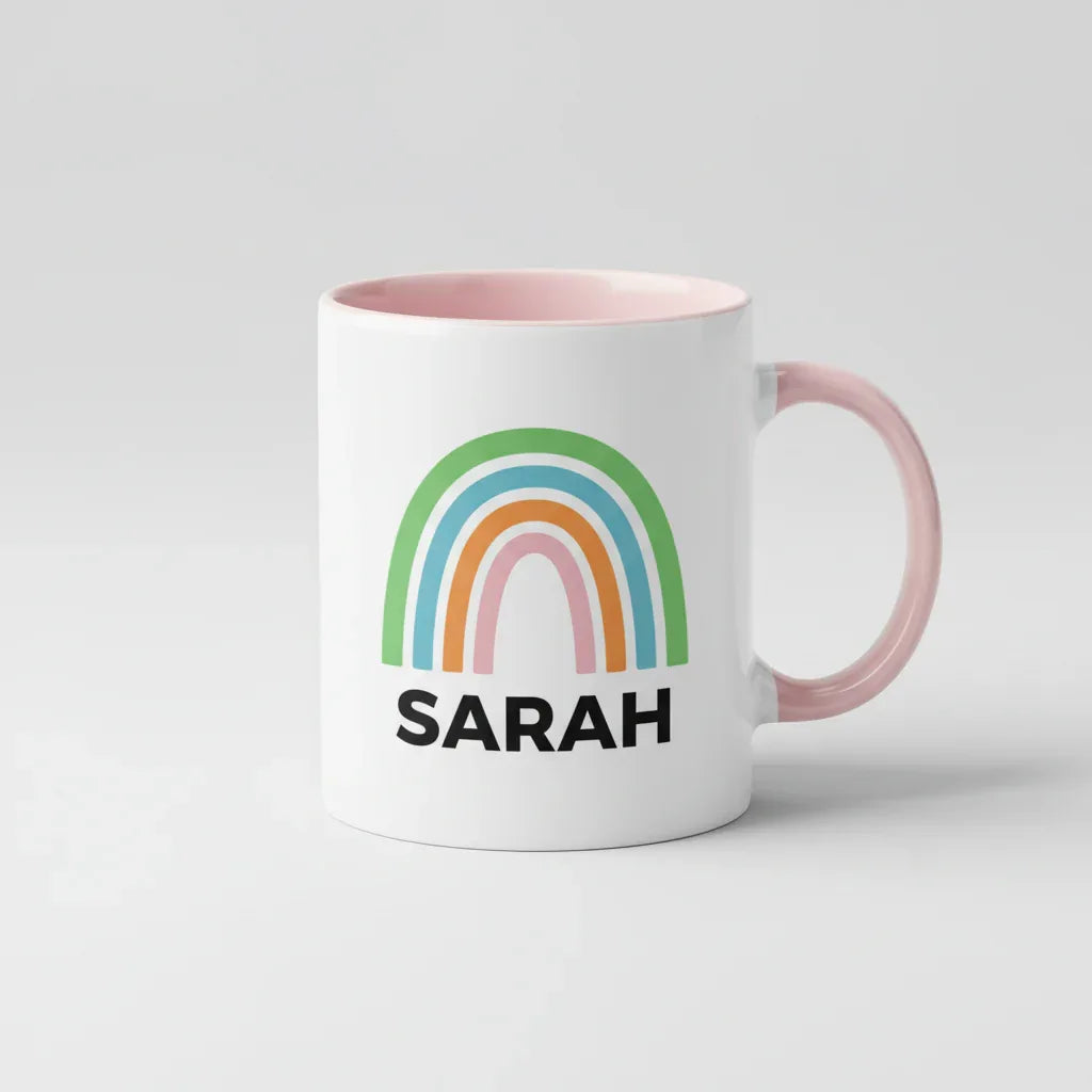 Personalised rainbow mug with name SARAH, pink handle and pink inner rim.