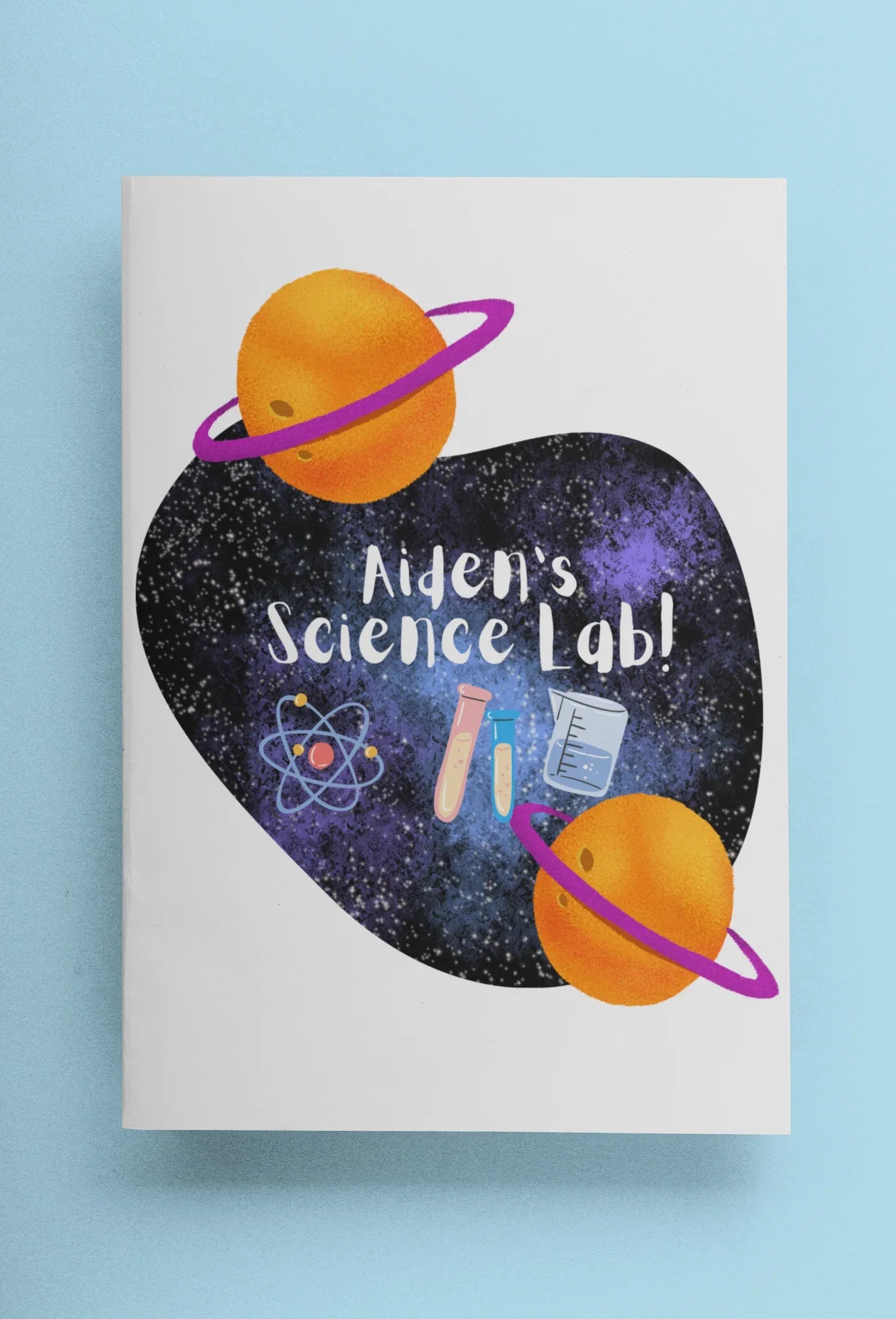 Science-themed journal cover with purple heart, orange planets, and “Alien’s Science Lab!”