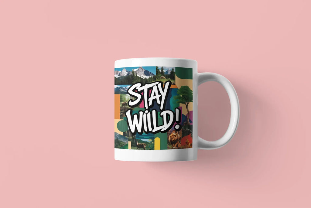 White ceramic mug with 'Stay Wild!' landscape graphic wrap and curved handle