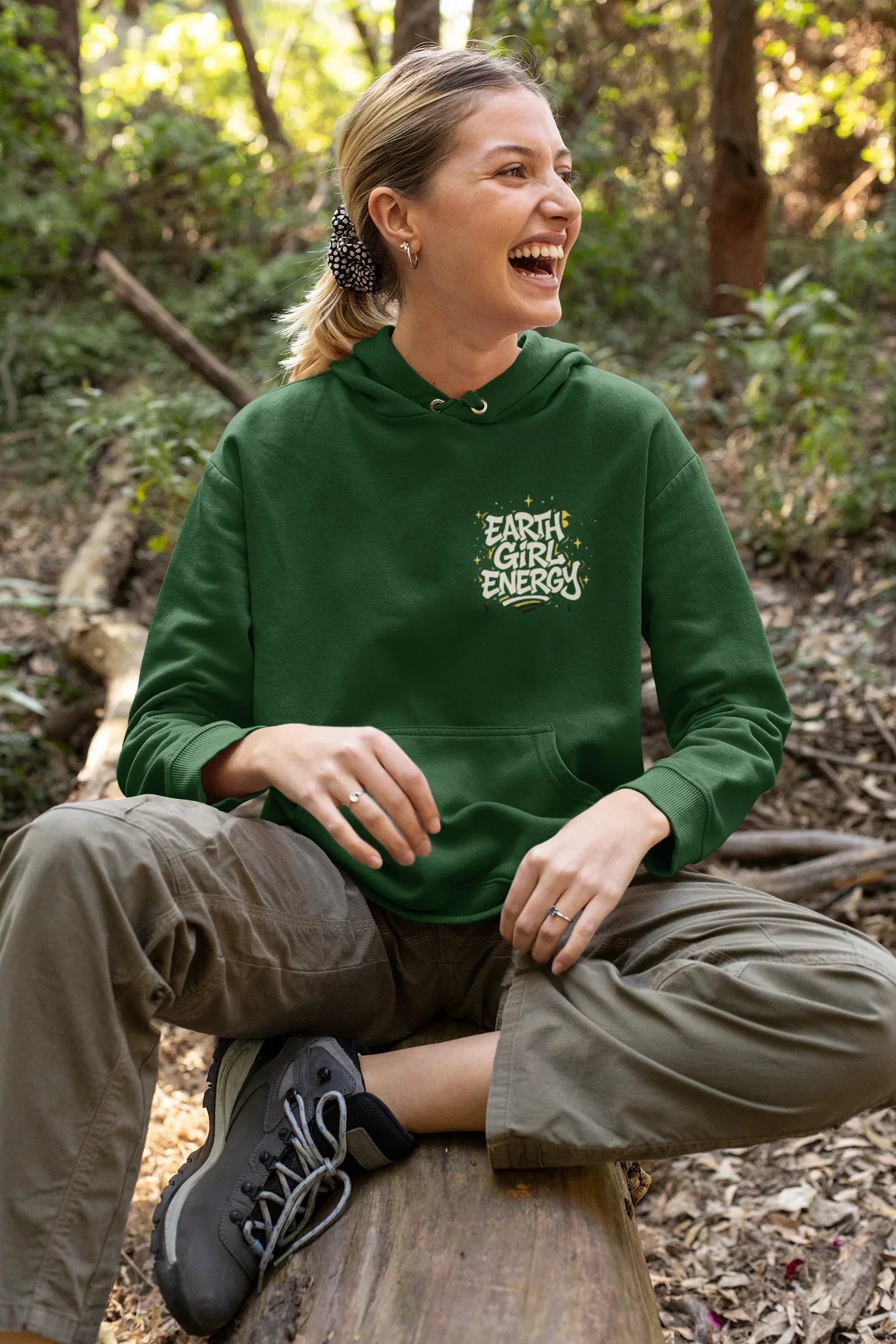 Green hoodie with front pouch pocket, drawstring hood, and "Earth Girl Energy" chest logo.