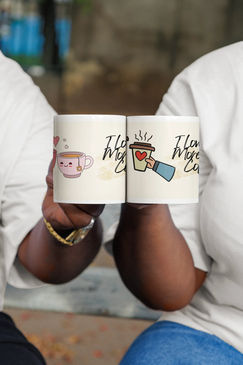 Two white coffee mugs with heart teacup icons and 'I love you more than coffee'.
