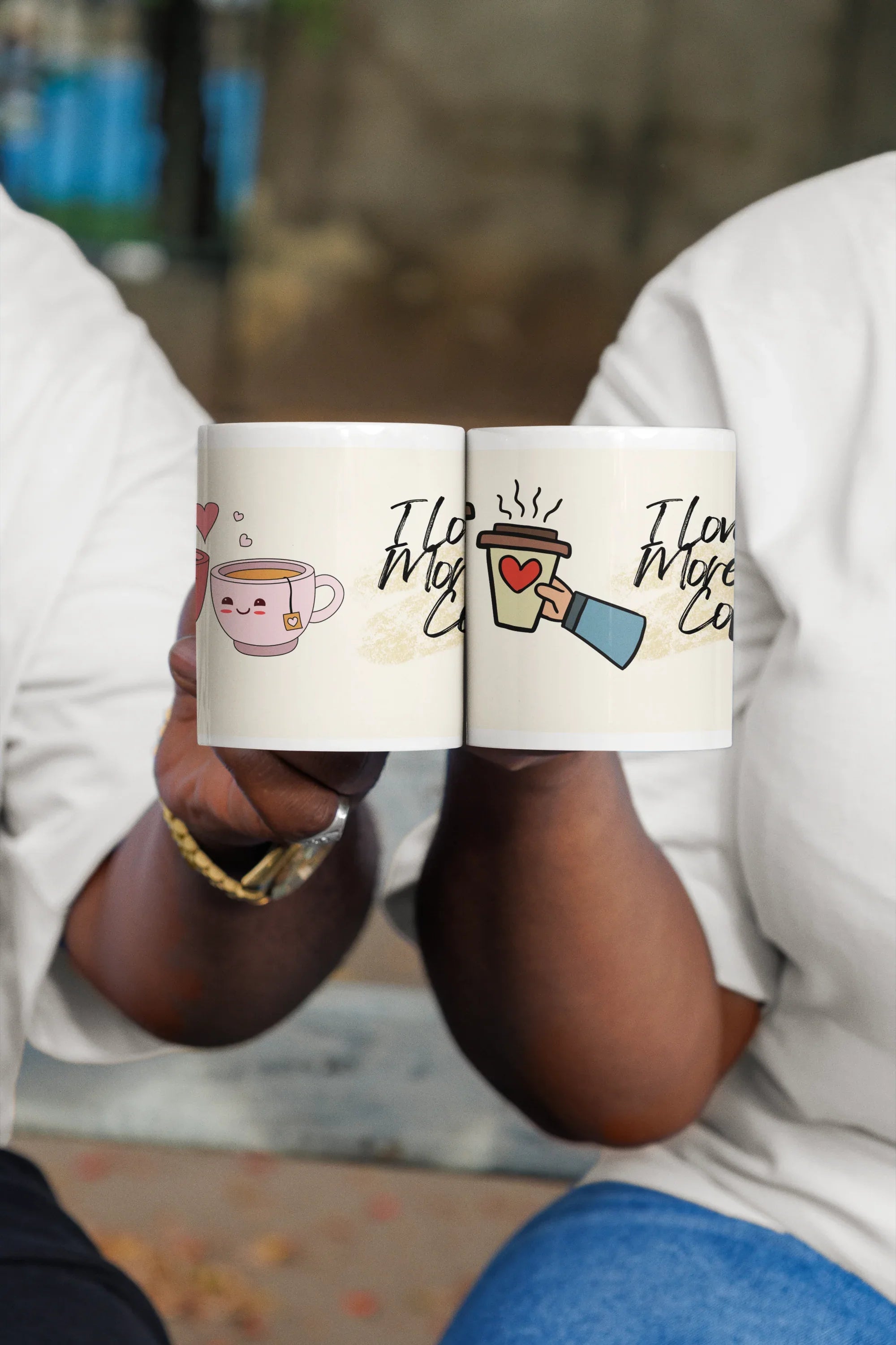 Two white coffee mugs with heart teacup icons and 'I love you more than coffee'.