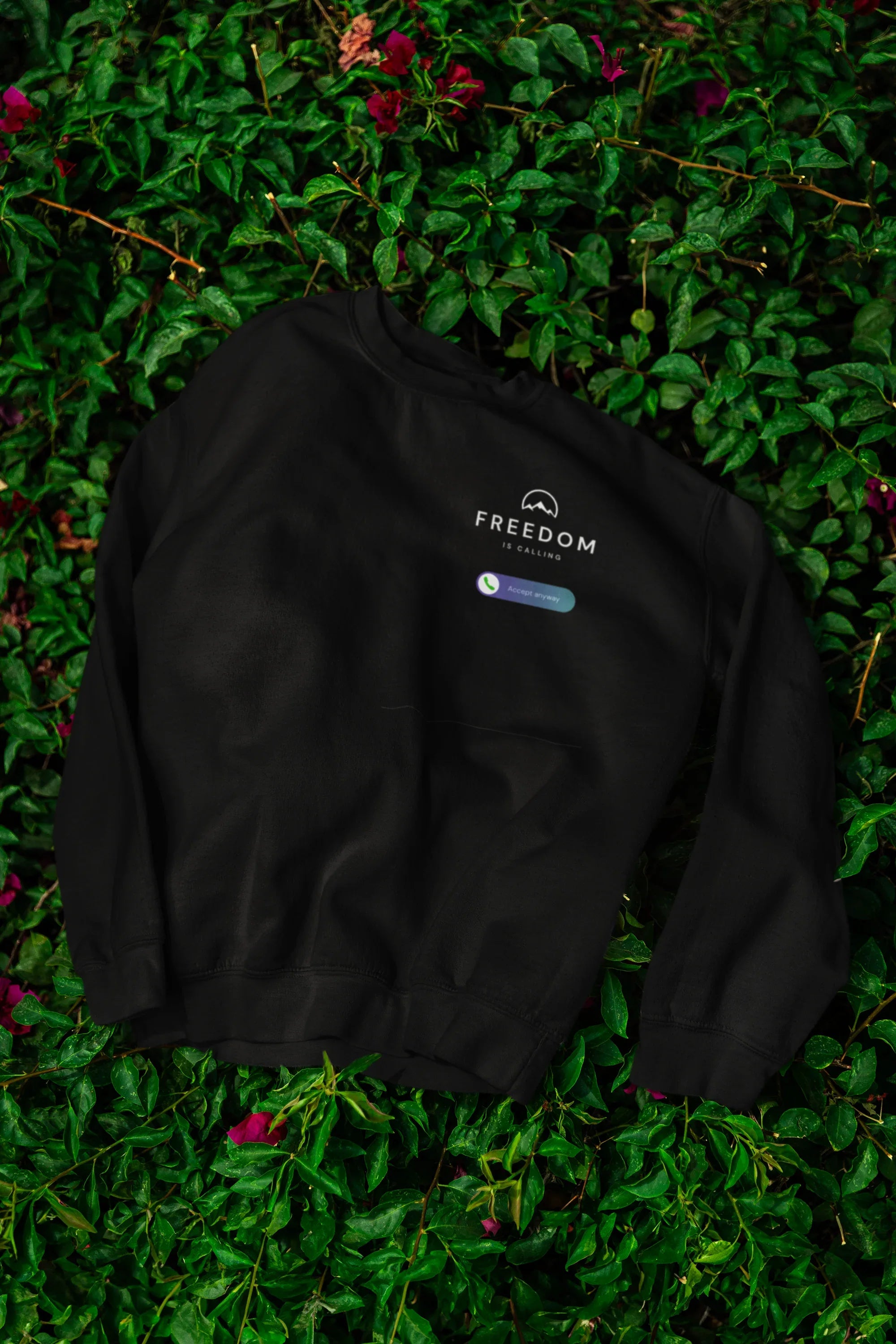 Black sweatshirt back side with Freedom logo and badge on chest