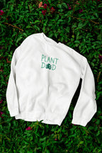 Arctic white crewneck sweatshirt with Plant Dad graphic on the back, long sleeves
