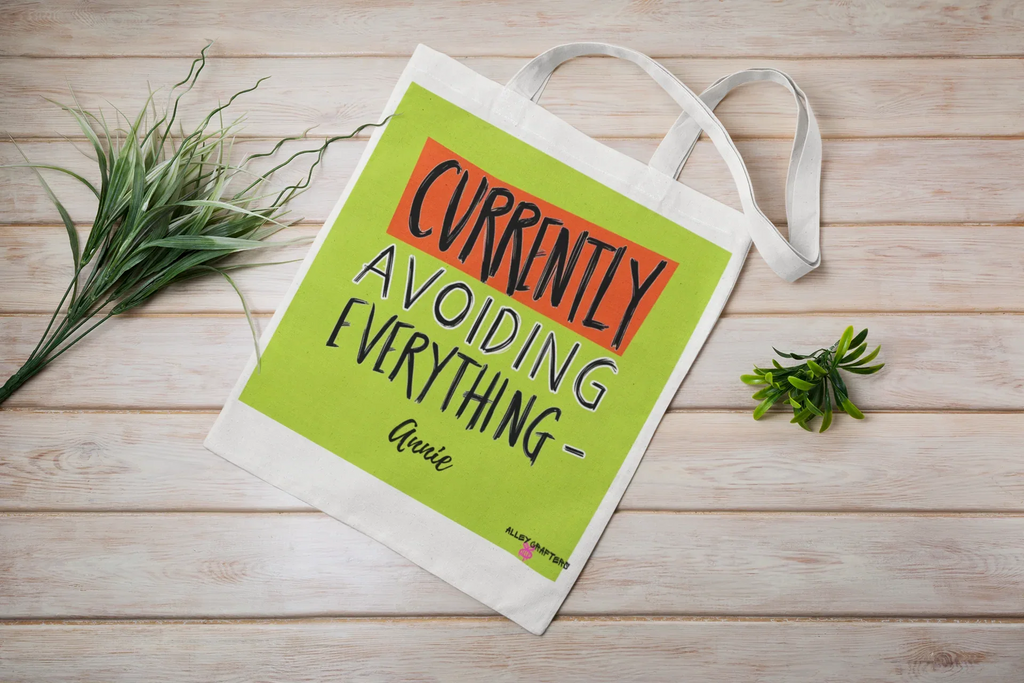 White canvas tote bag with lime green front panel and 'Currently Avoiding Everything-' print, Lysa
