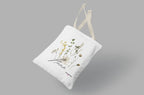 White tote bag with botanical wildflower print, long fabric handles
