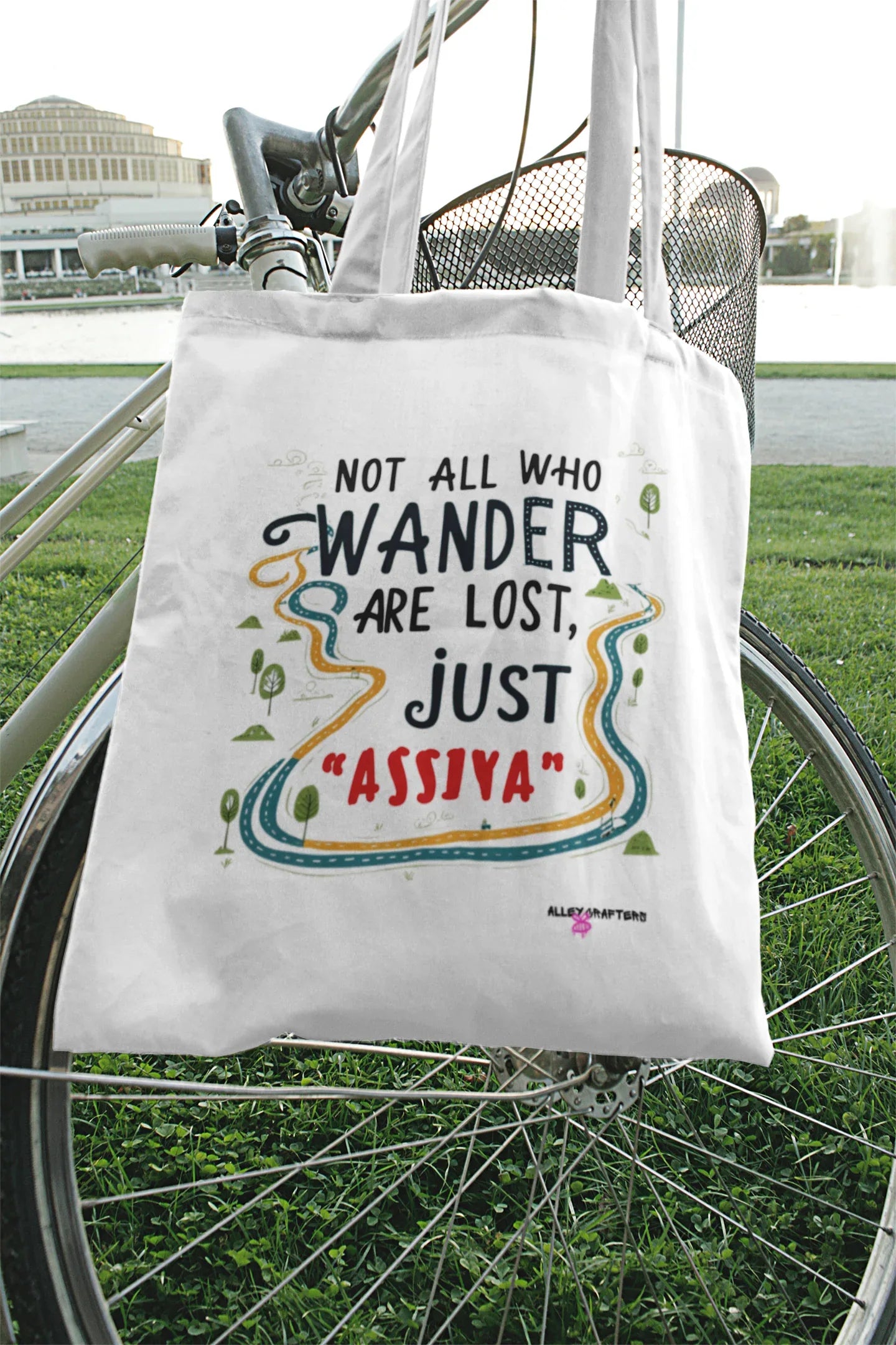 White tote bag with colorful quote graphic and loop handles