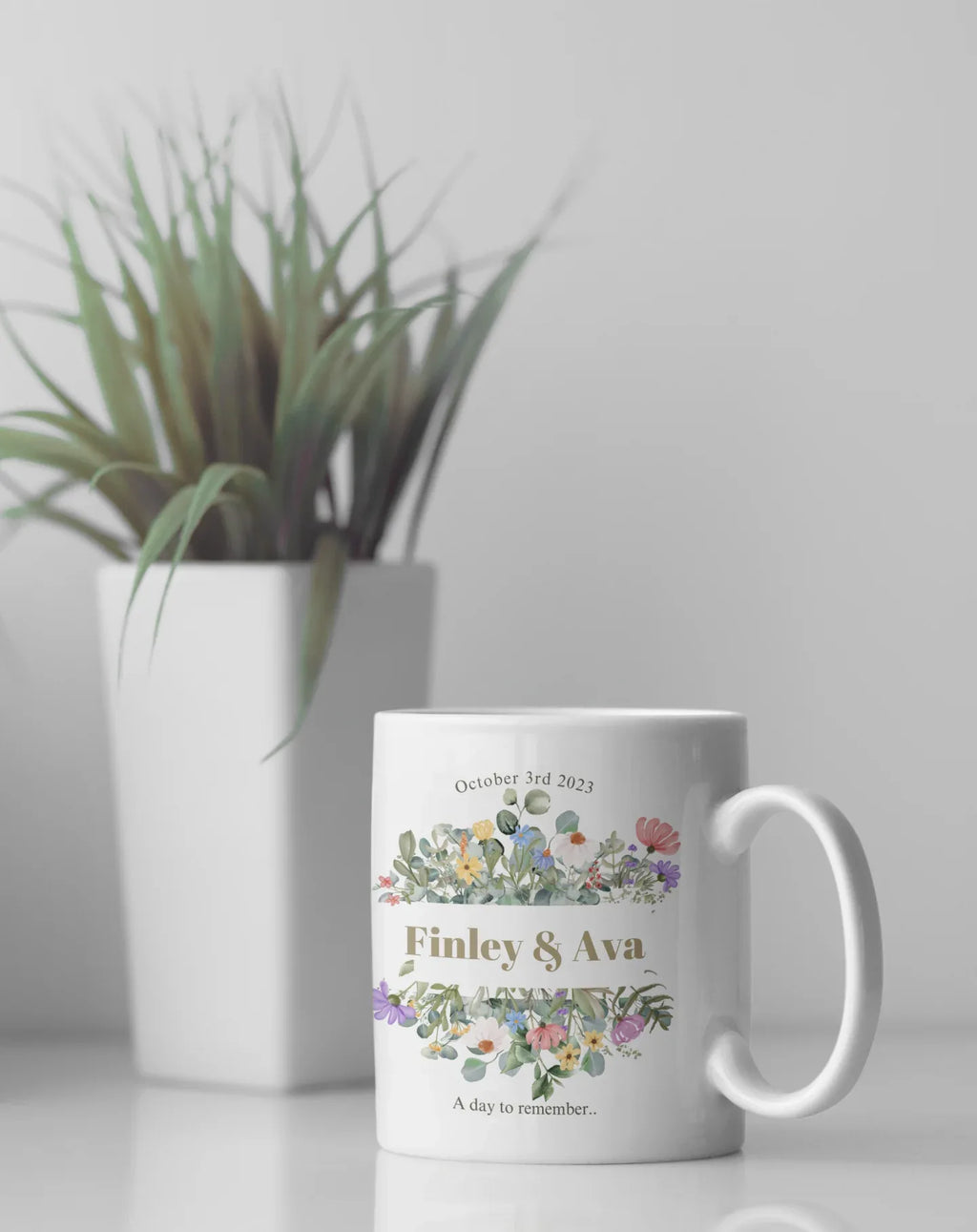 White mug with floral design, 'Finley & Ava' and 'October 3rd, 2023'