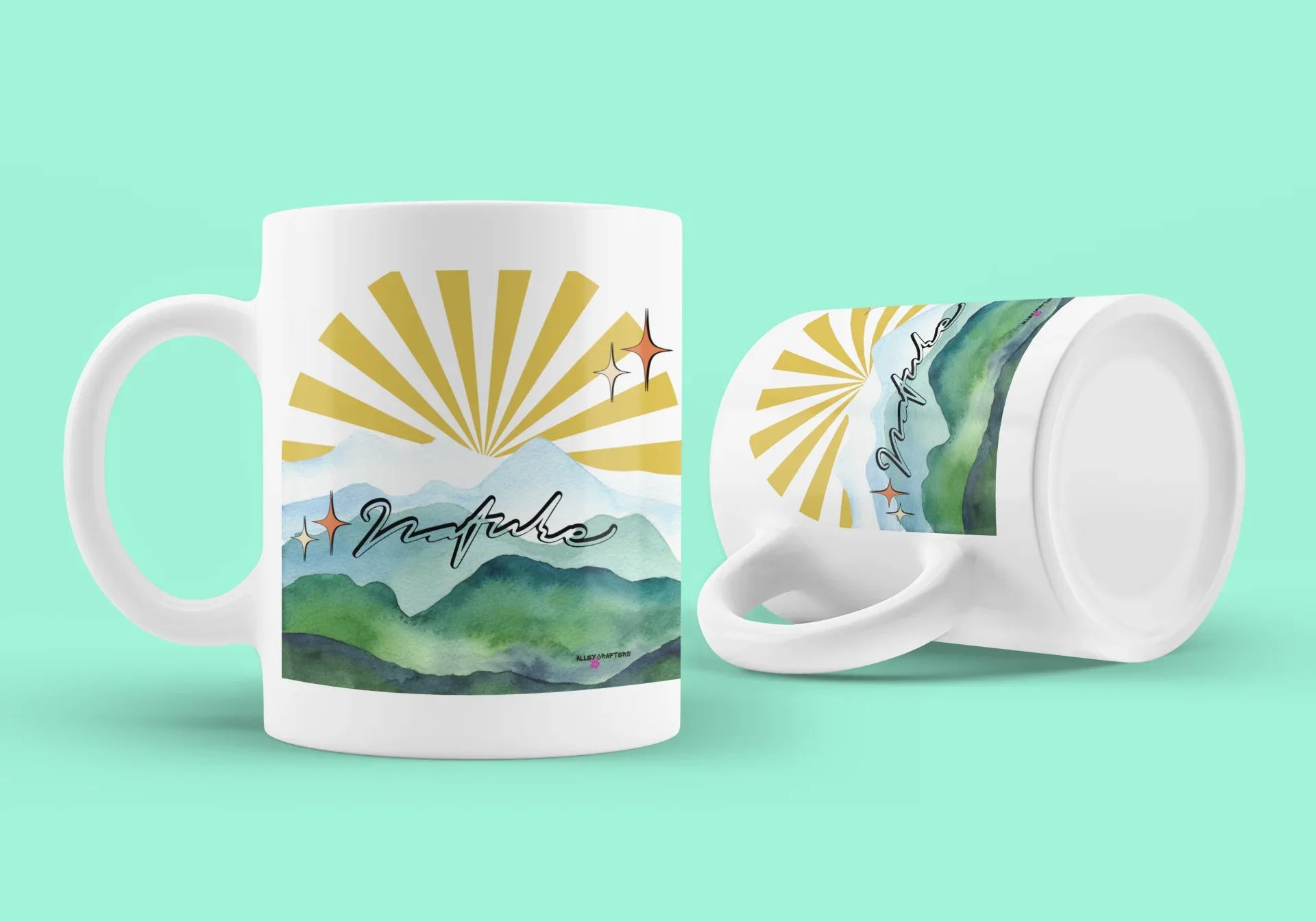 White coffee mug with sunrise landscape graphic; side view shows matching print