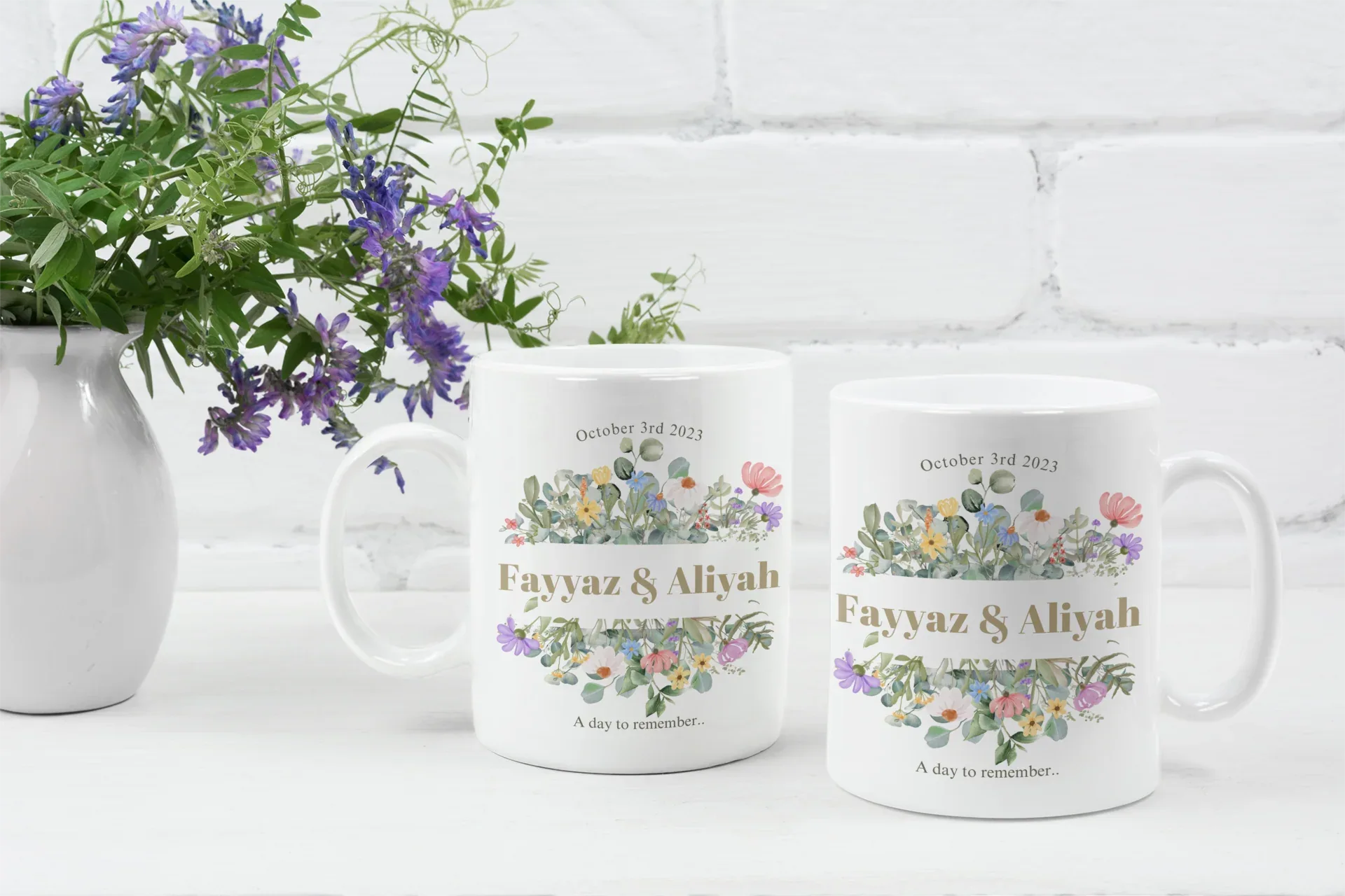White mugs with floral designs, 'Fayvaz & Aliyah' and 'October 3rd, 2023'