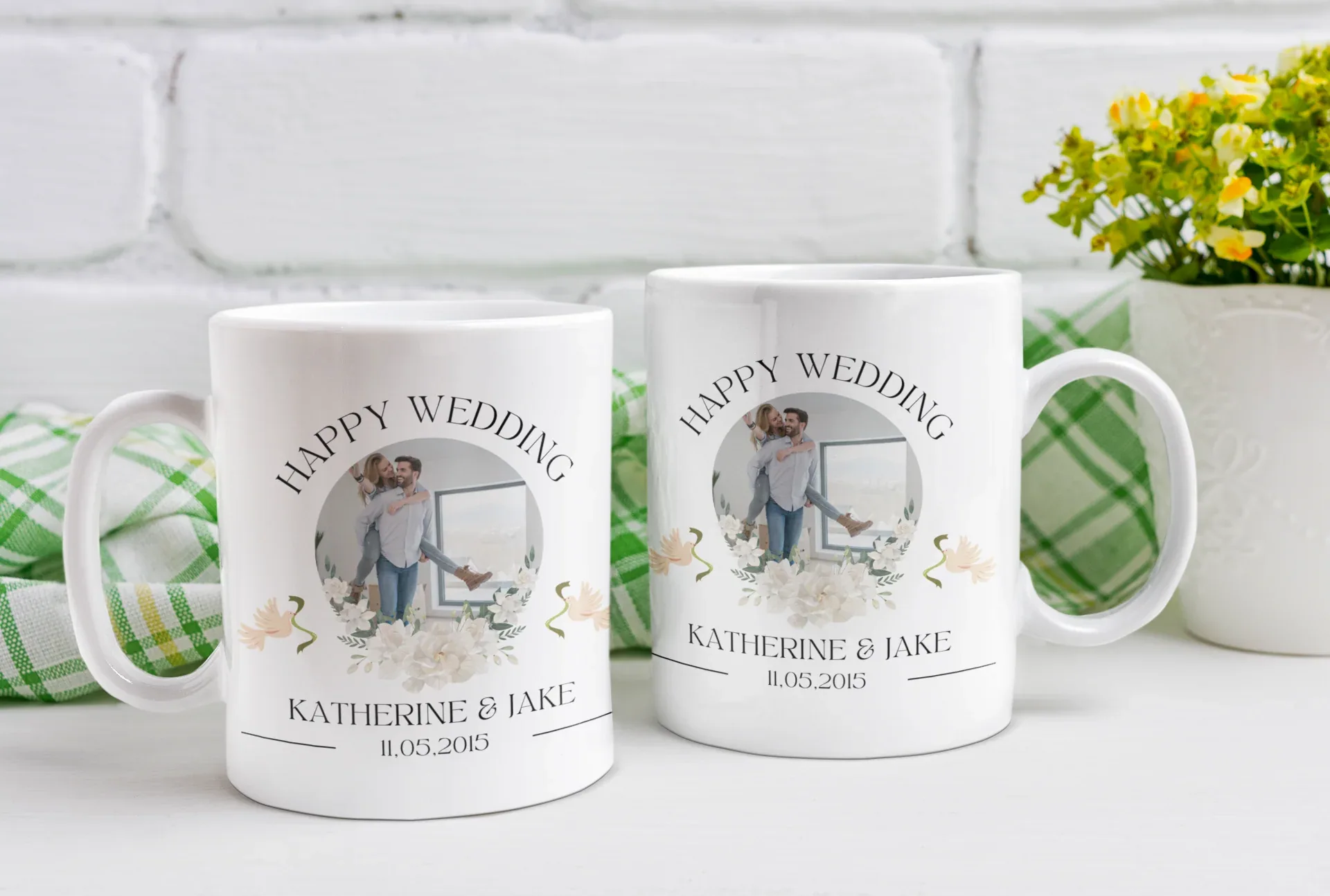 Two white wedding mugs with “Happy Wedding” and name Katherine & Jake