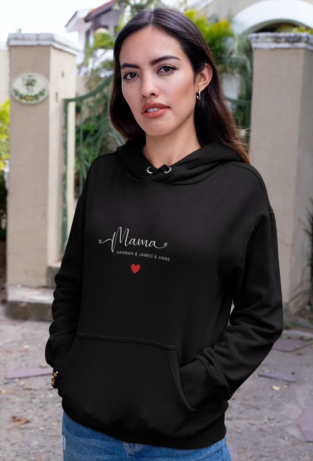Black hooded sweatshirt with front pocket and “Mama” print with red heart
