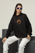 Black hooded sweatshirt with front pocket and orange flame face logo on chest
