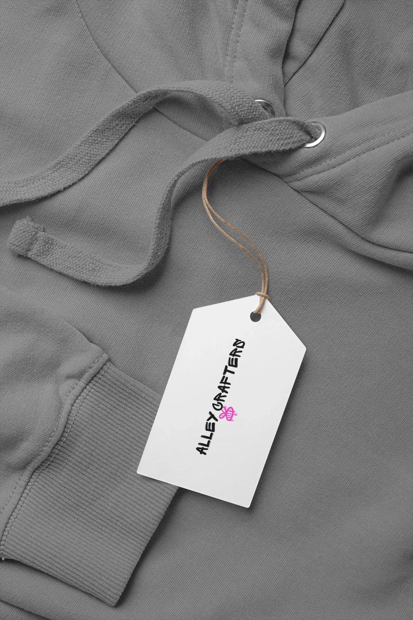 Dark gray kids hoodie with drawstring hood, kangaroo pocket, and attached product tag