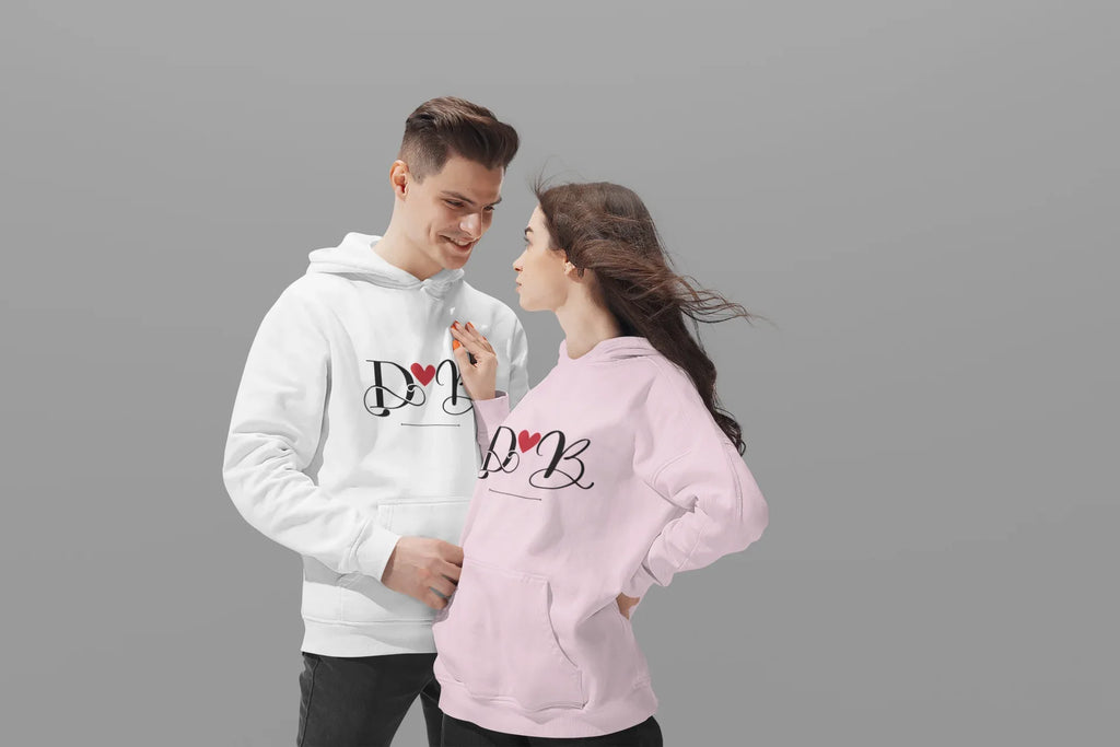Couples hoodie set, white and light pink, front view with heart monogram design