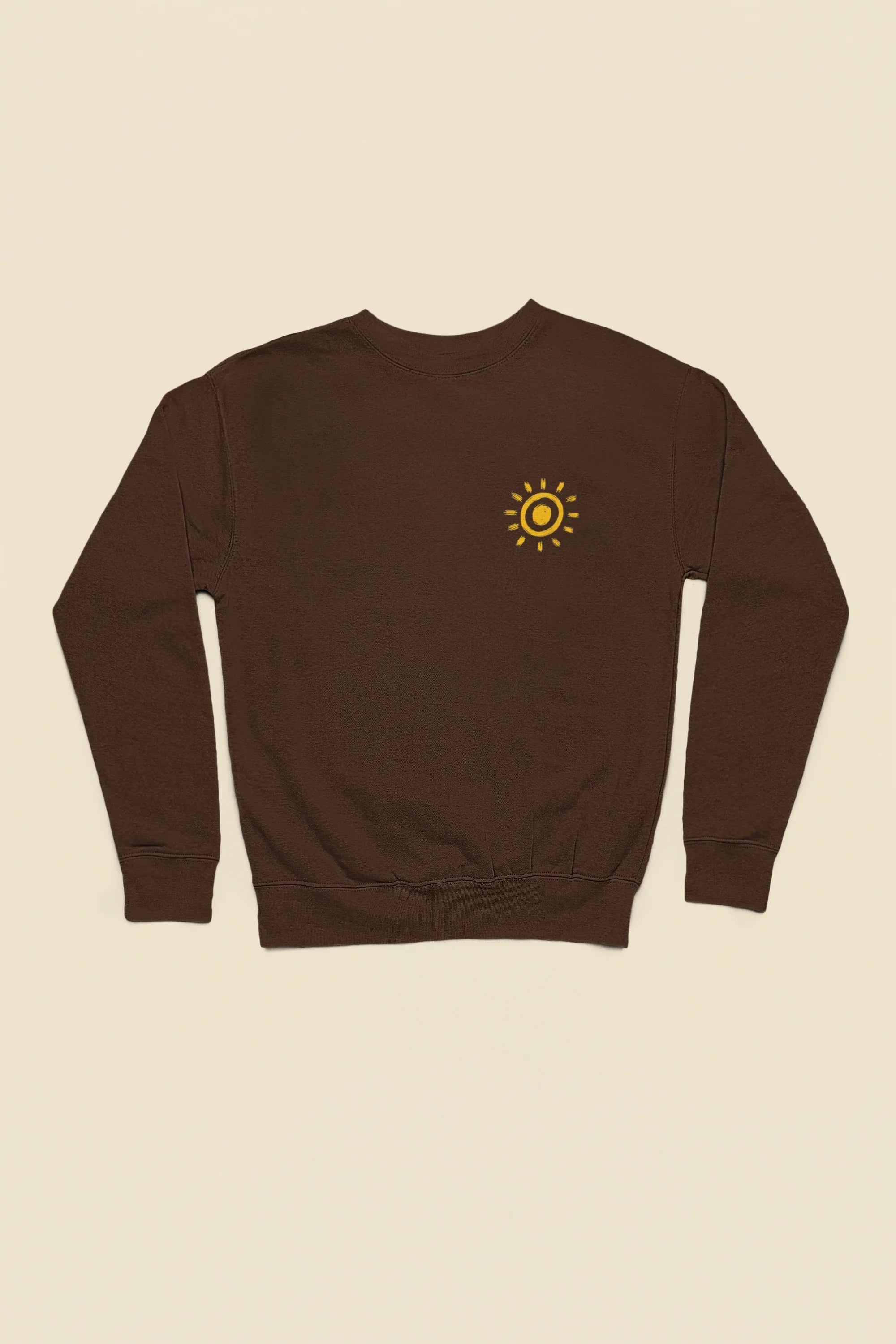 Chocolate sweatshirt with small sun graphic on the front chest.