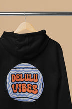 Black hoodie back with hood, showing circular retro slogan graphic on chest