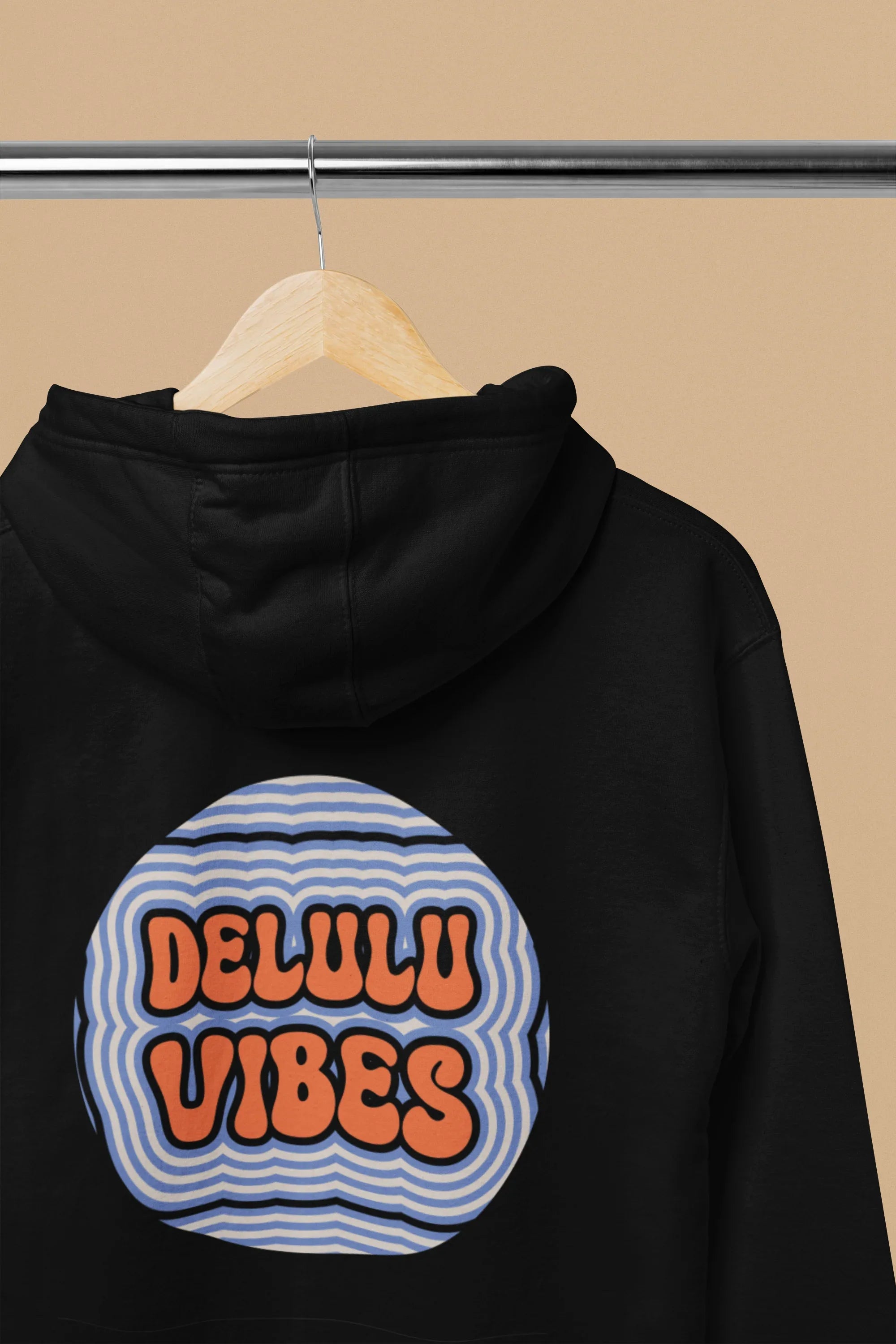 Black hoodie back with hood, showing circular retro slogan graphic on chest