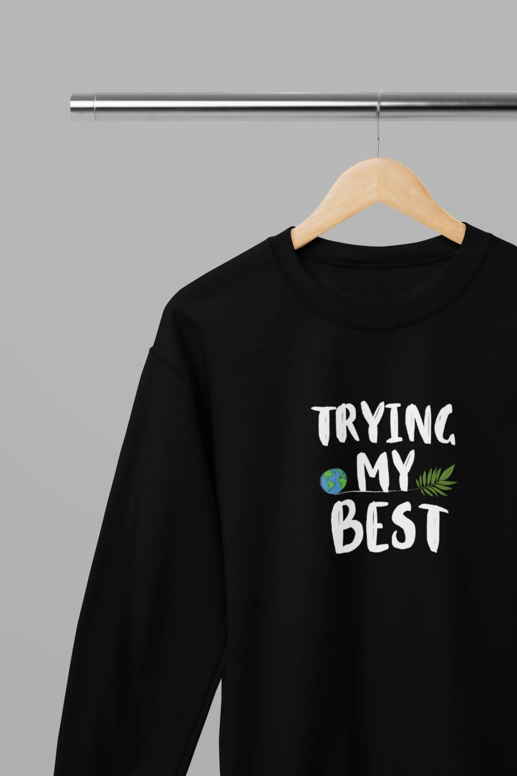 Black crewneck sweatshirt with "Trying My Best" text graphic on the front