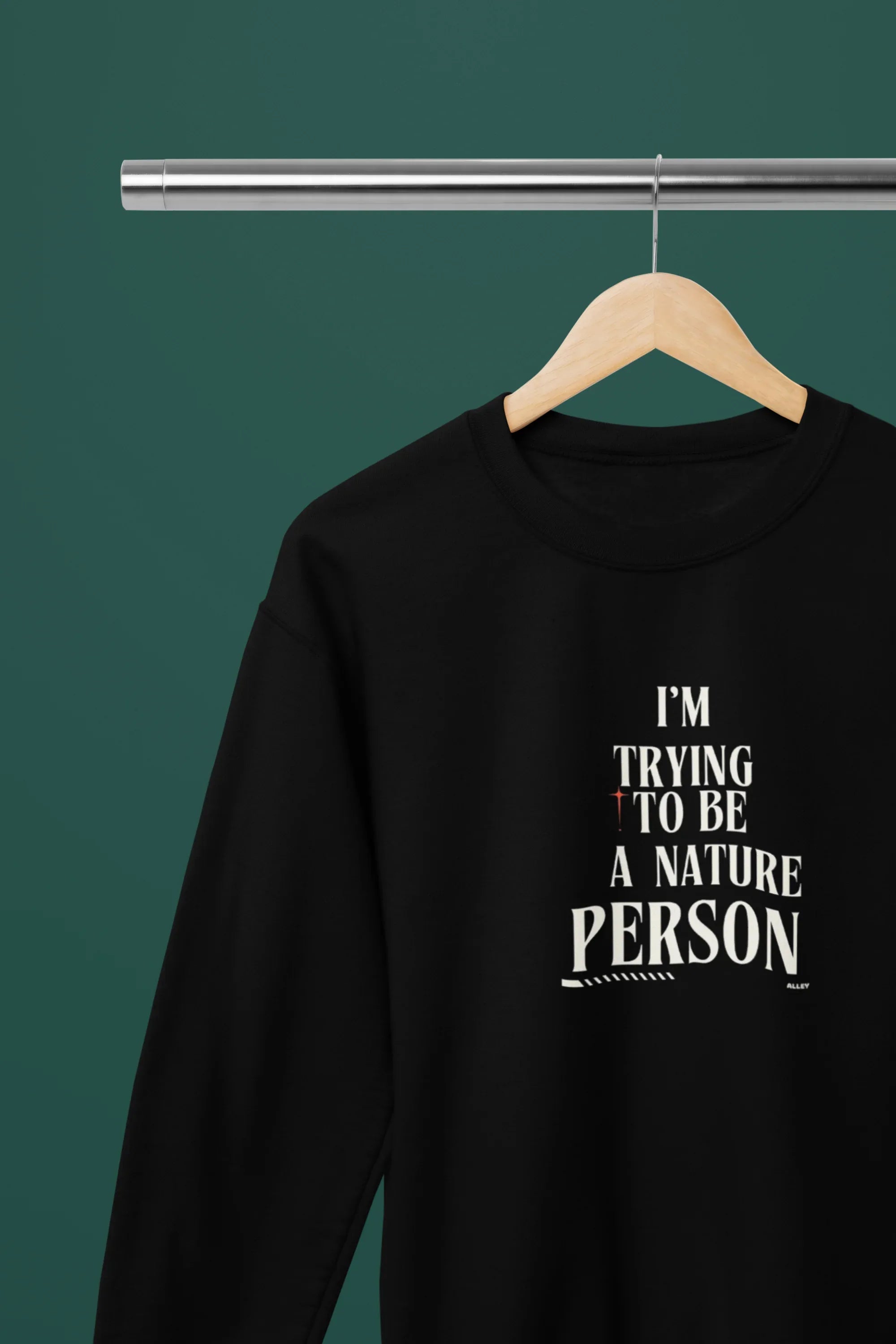 Black sweatshirt with 'I'm Trying to Be a Nature Person' slogan in white