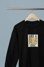 Black crewneck sweatshirt with square front graphic print on a wooden hanger