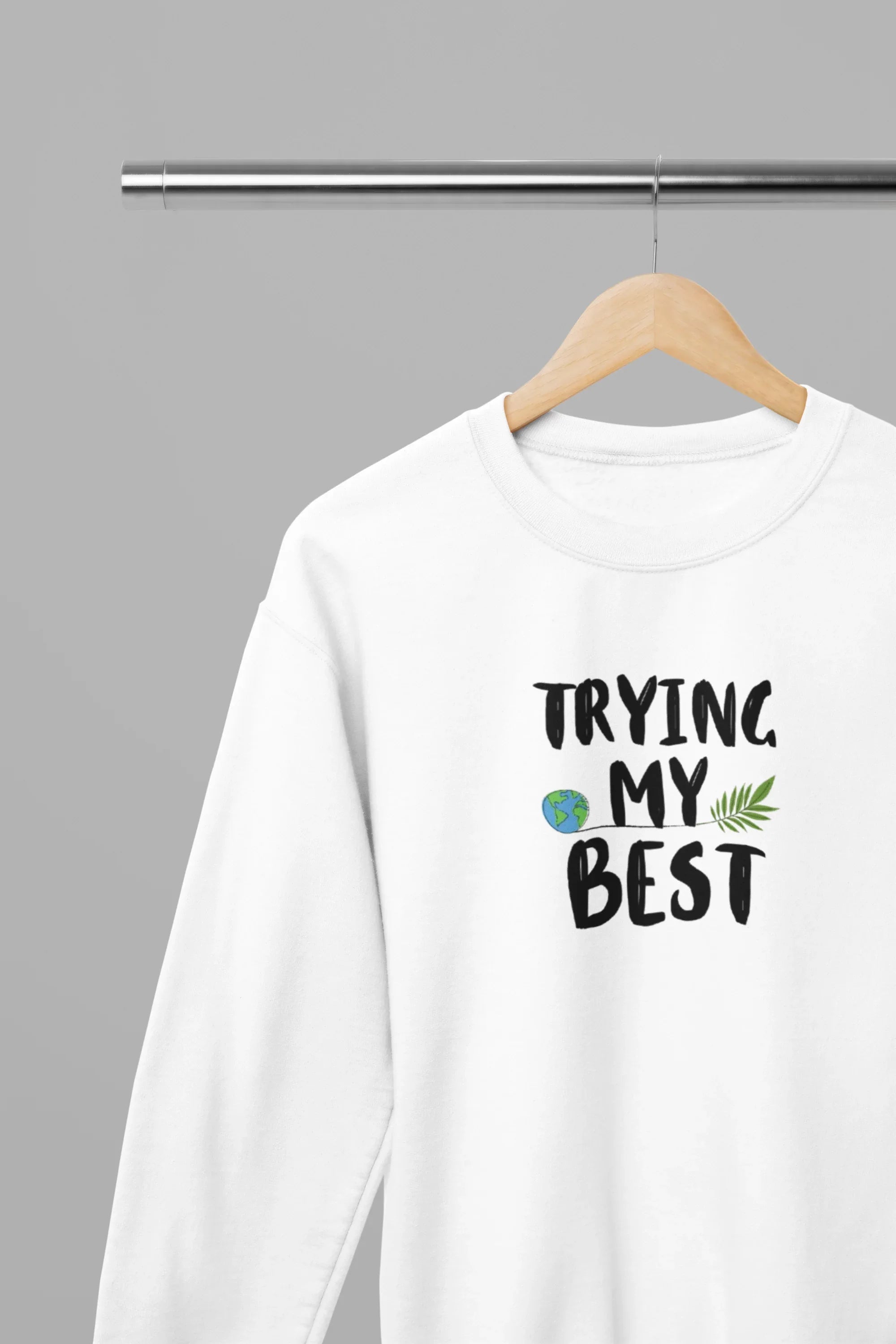 White crewneck sweatshirt with "Trying My Best" text graphic on the front