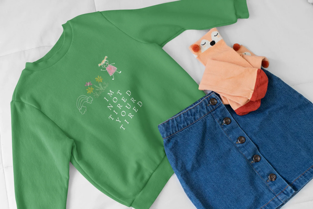 Kelly green kids sweatshirt with 'I'm Not Tired, You're Tired' character graphic