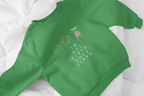 Kelly green kids sweatshirt close-up with character graphic and 'I'm Not Tired, You're Tired'