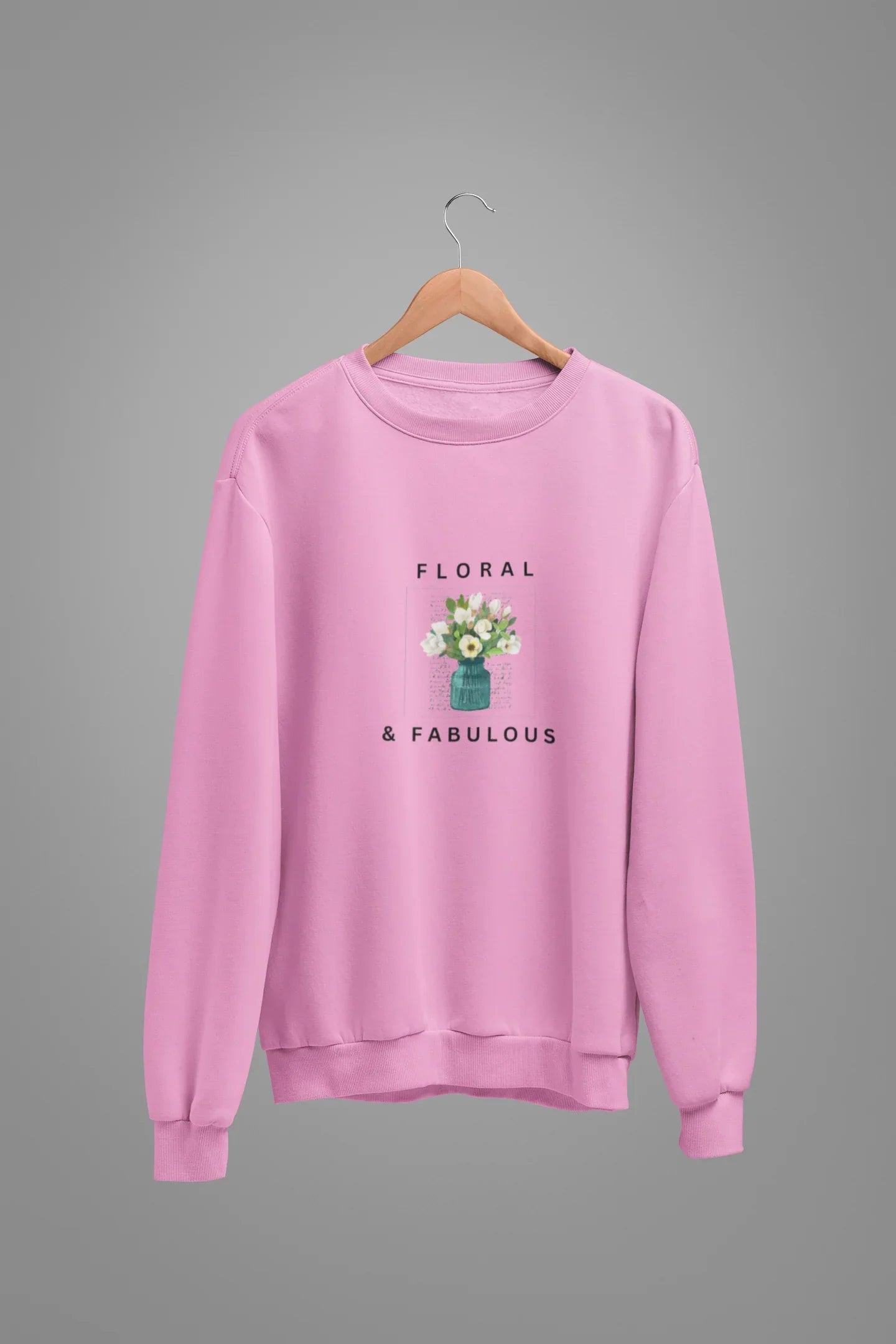 Pink sweatshirt with small floral bouquet in vase graphic and 'Floral & Fabulous' text