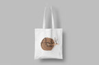 White canvas tote bag with Amalia's Tote round logo