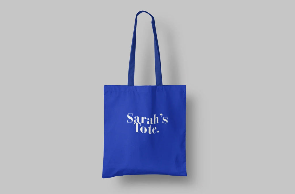 Blue cotton tote bag with custom text "Sarah's Tote."