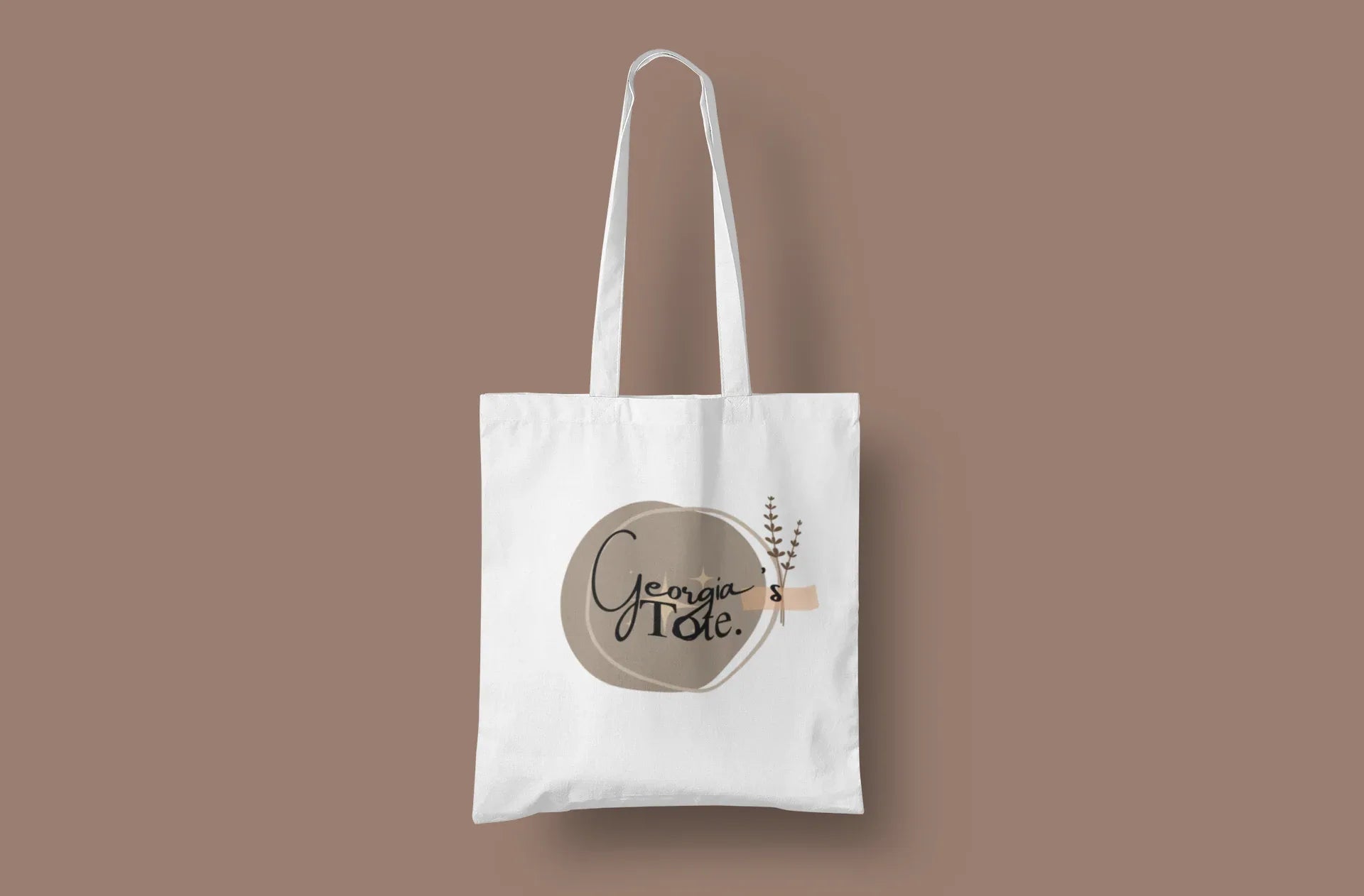 White canvas tote bag with short handles and Lena's Tote round logo