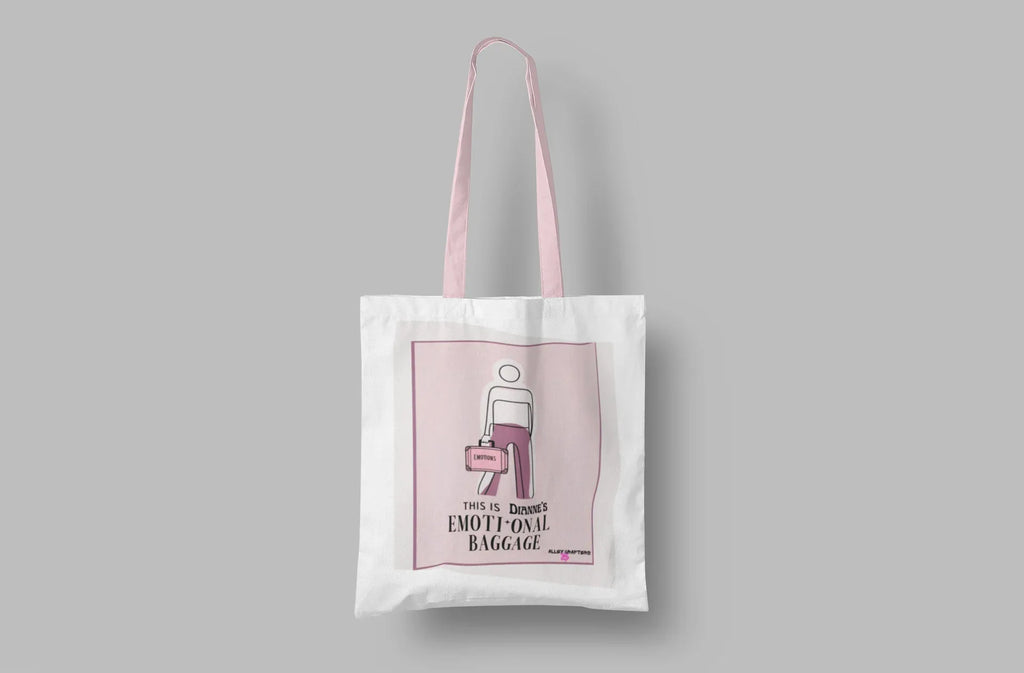 White canvas tote bag on a solid background with pink graphic panel.