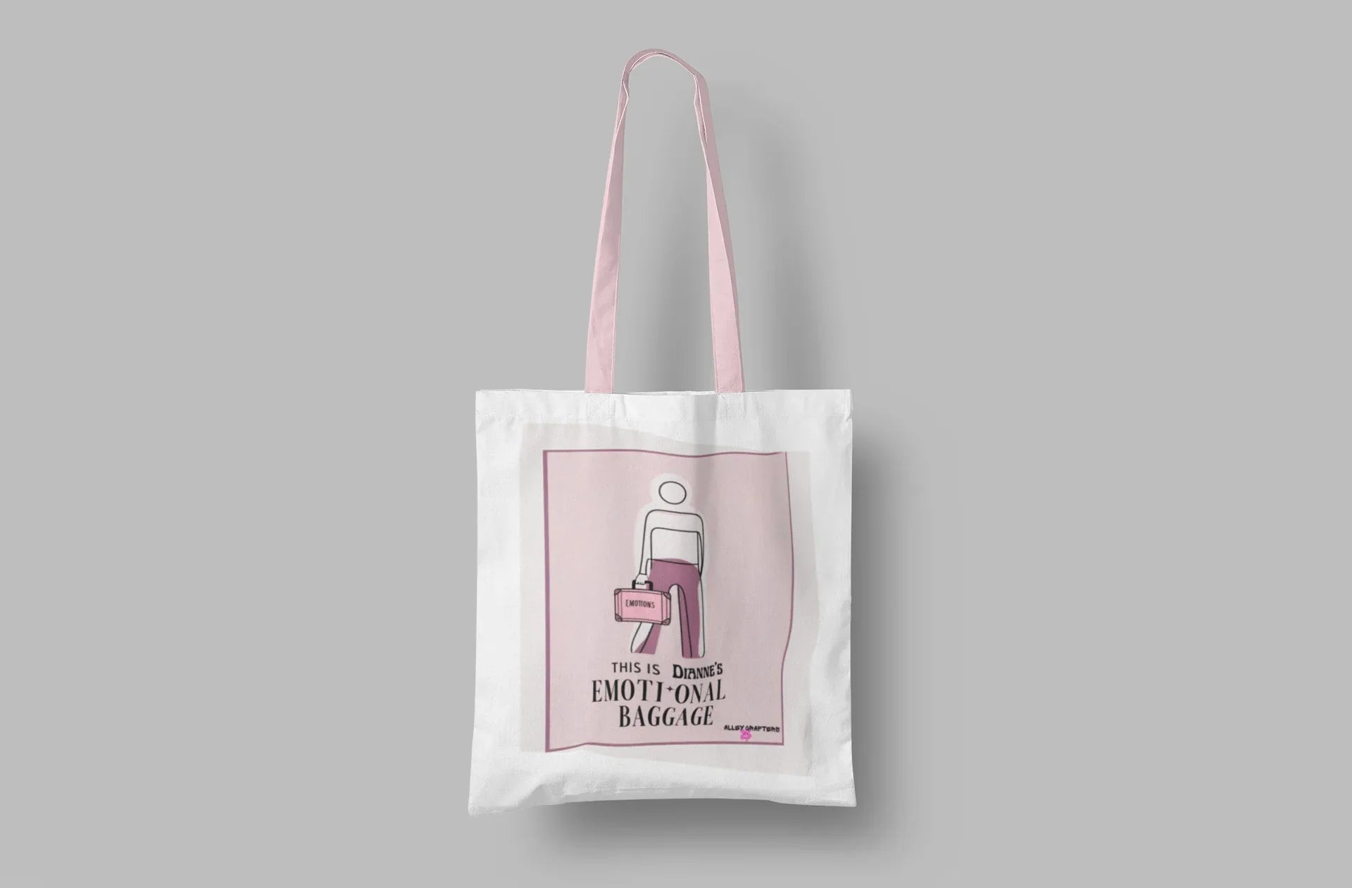 White canvas tote bag on a solid background with pink graphic panel.