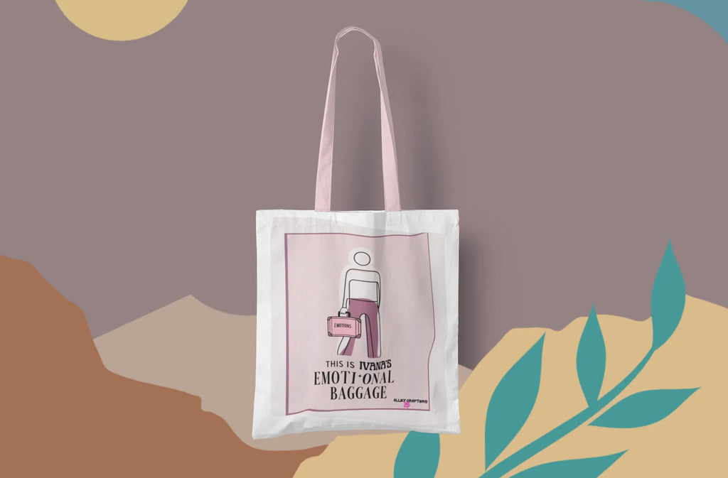 White canvas tote bag with pink graphic panel, shown centered against artwork.