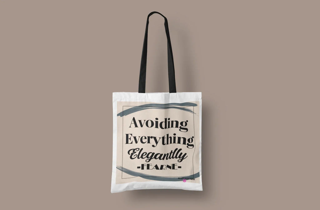 White canvas tote bag with short handles, "Avoiding Everything Elegantly" print