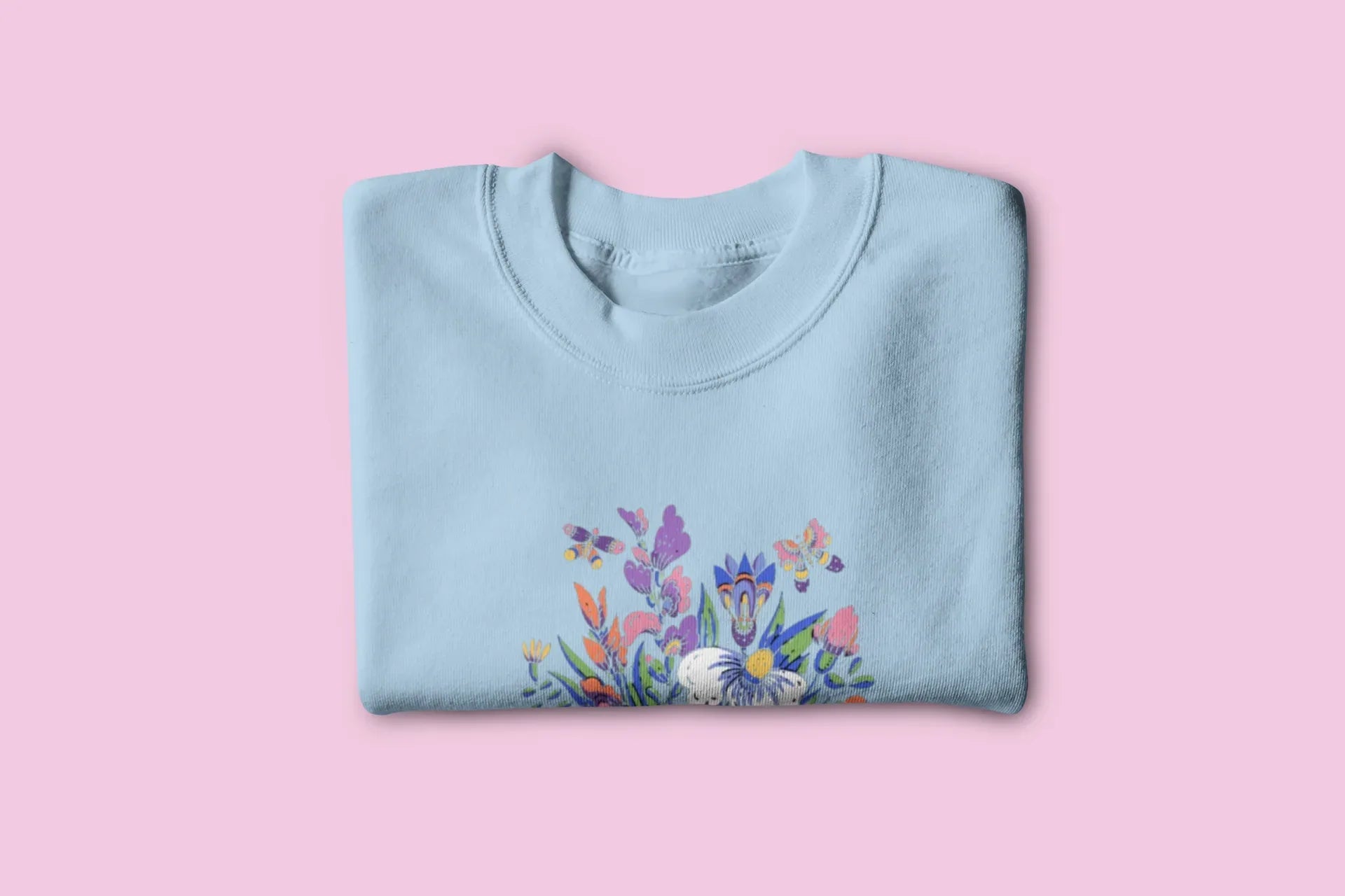 Light blue floral crewneck sweatshirt with colorful garden graphic on front