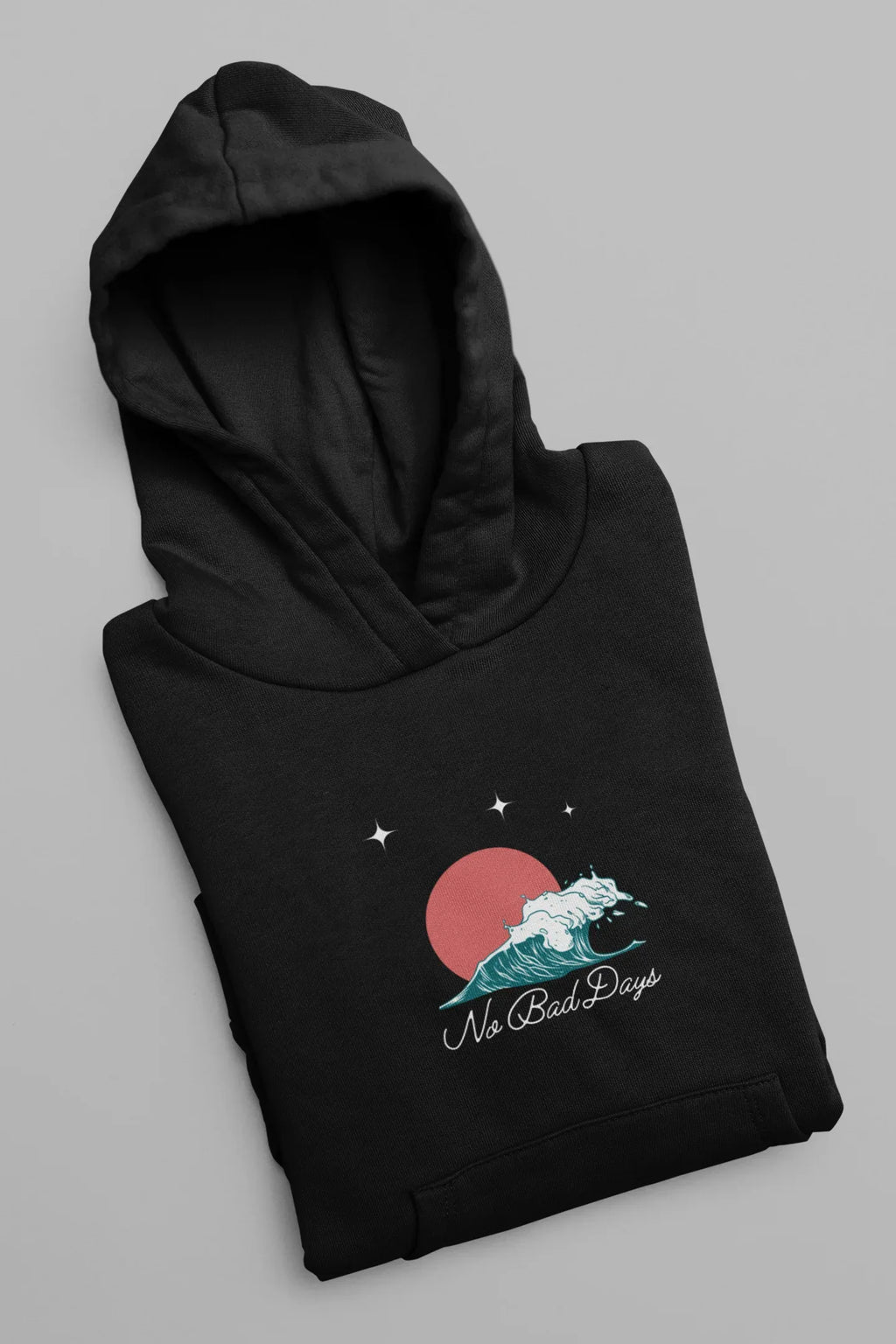 Black hooded sweatshirt folded, star and No Bad Days graphic on chest