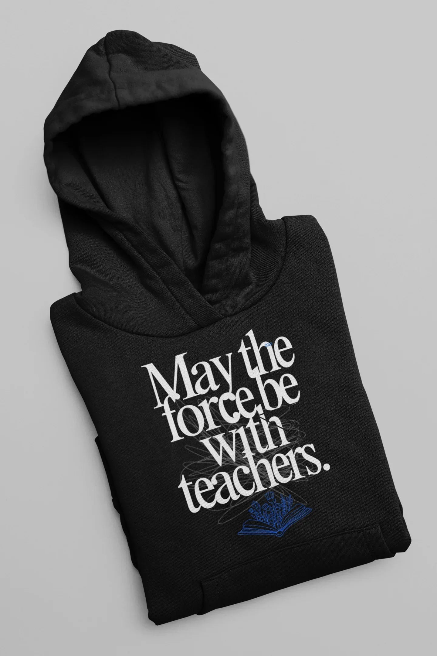 Black hooded sweatshirt with front graphic text and blue book emblem, folded.