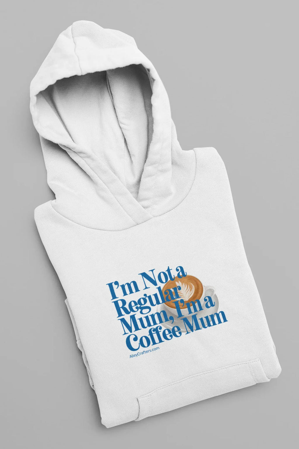 White hoodie sweatshirt folded with hood and blue “Not a Regular Mum, Coffee Mum” print