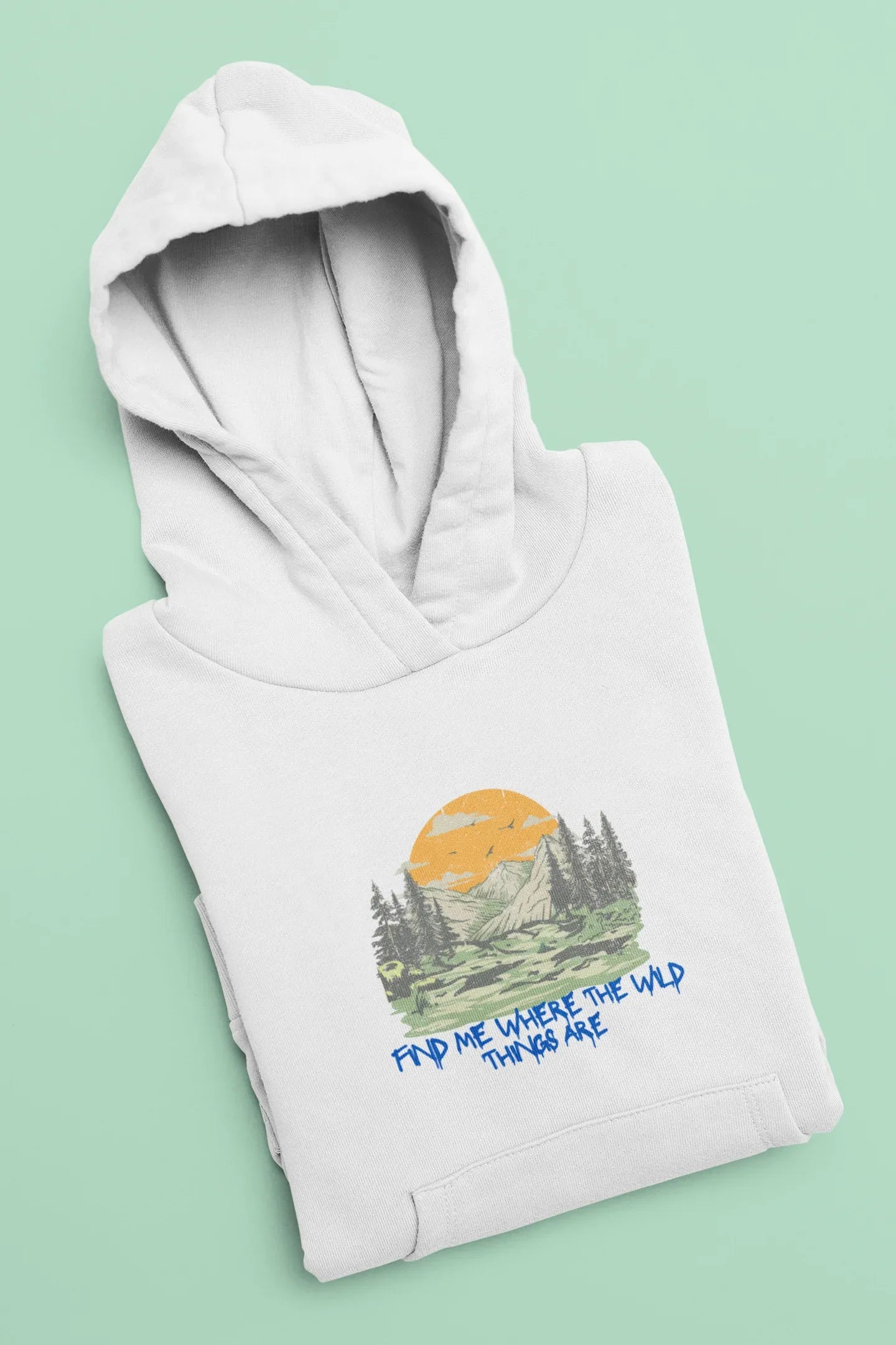 White hoodie folded, hooded sweatshirt with mountain forest graphic and blue text
