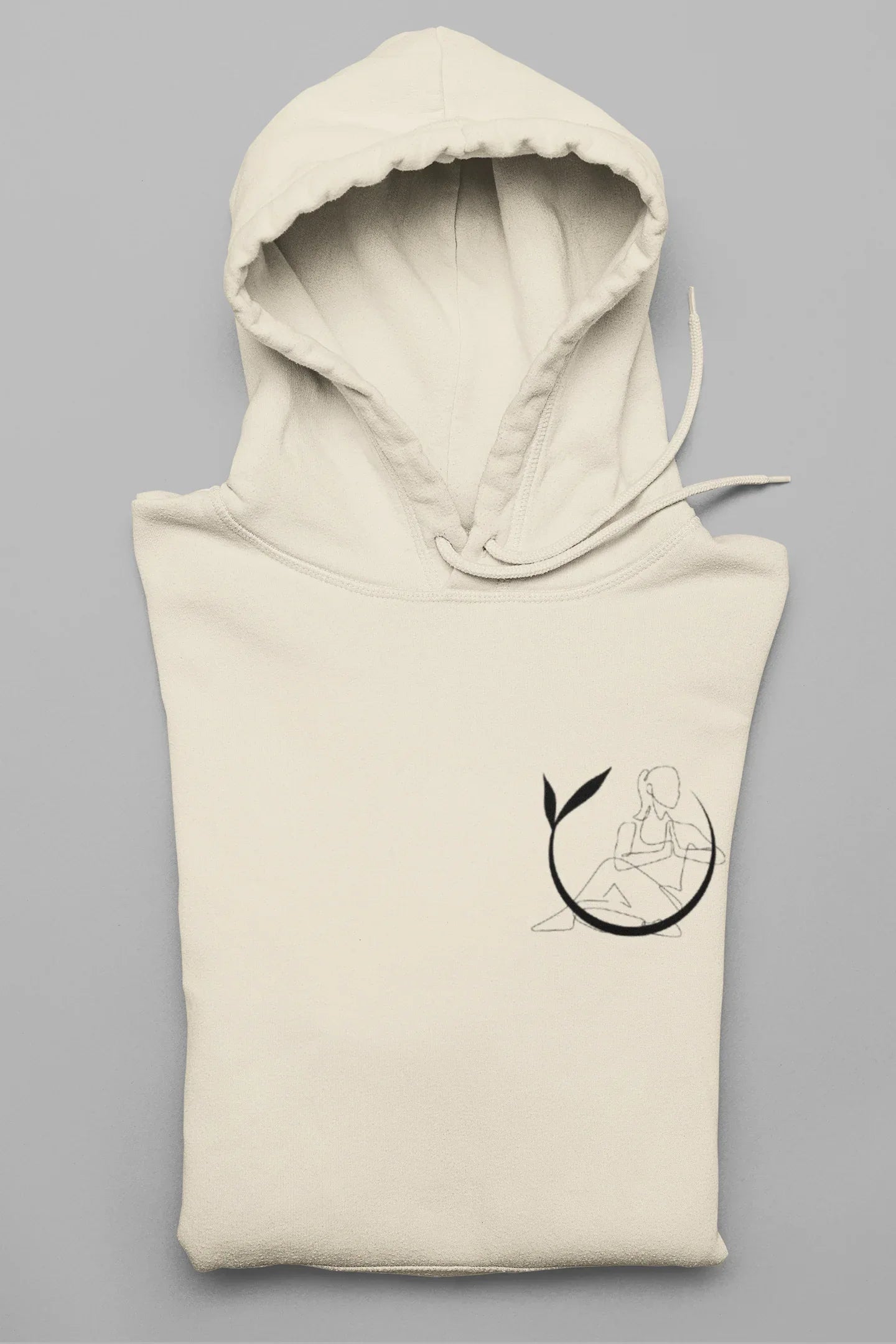 Cream yoga hoodie with hood, long sleeves, and black yoga figure logo
