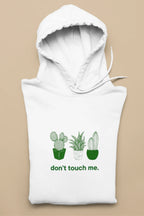 White pullover hoodie with green cactus graphic and "don't touch me." text