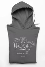 Charcoal wedding day hoodie sweatshirt with “The Wedding” front logo and hood
