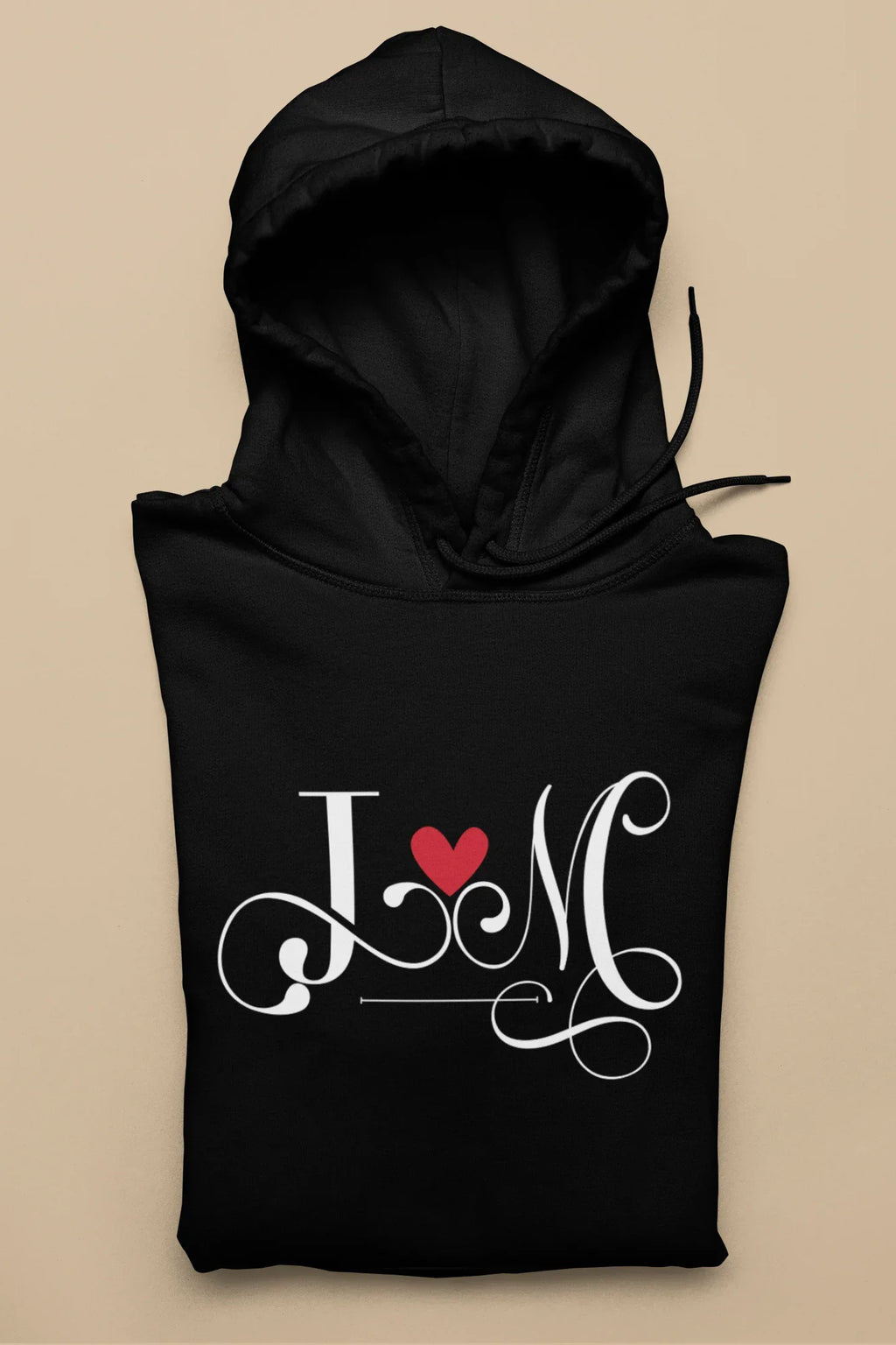 Black hoodie with heart monogram graphic on front, kangaroo pocket, drawstring hood