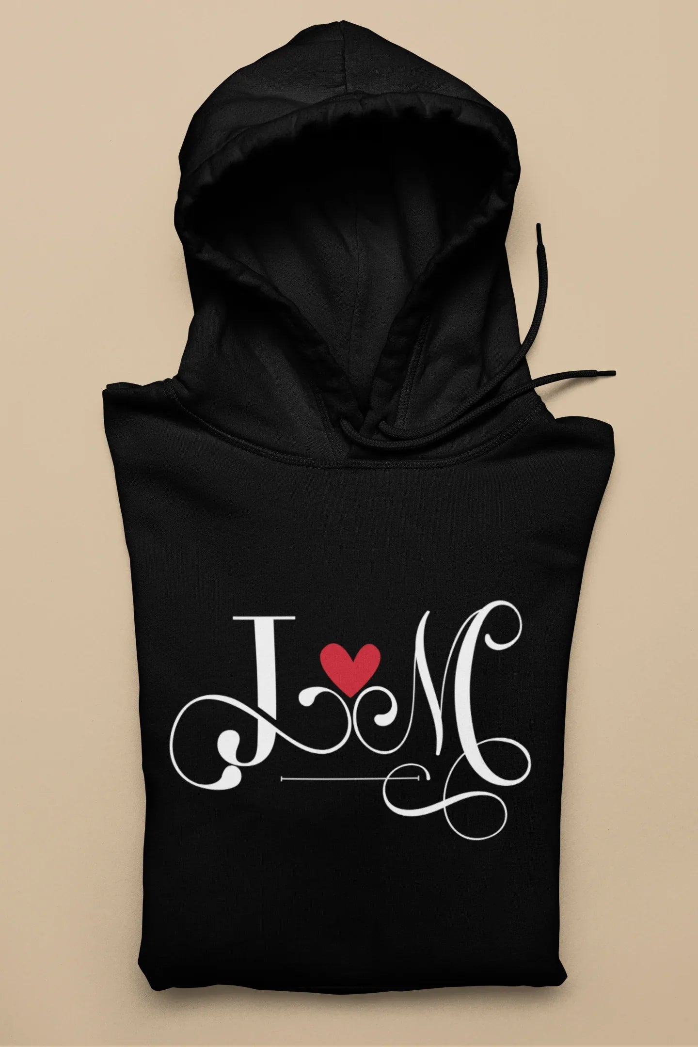 Black hoodie with heart monogram graphic on front, kangaroo pocket, drawstring hood