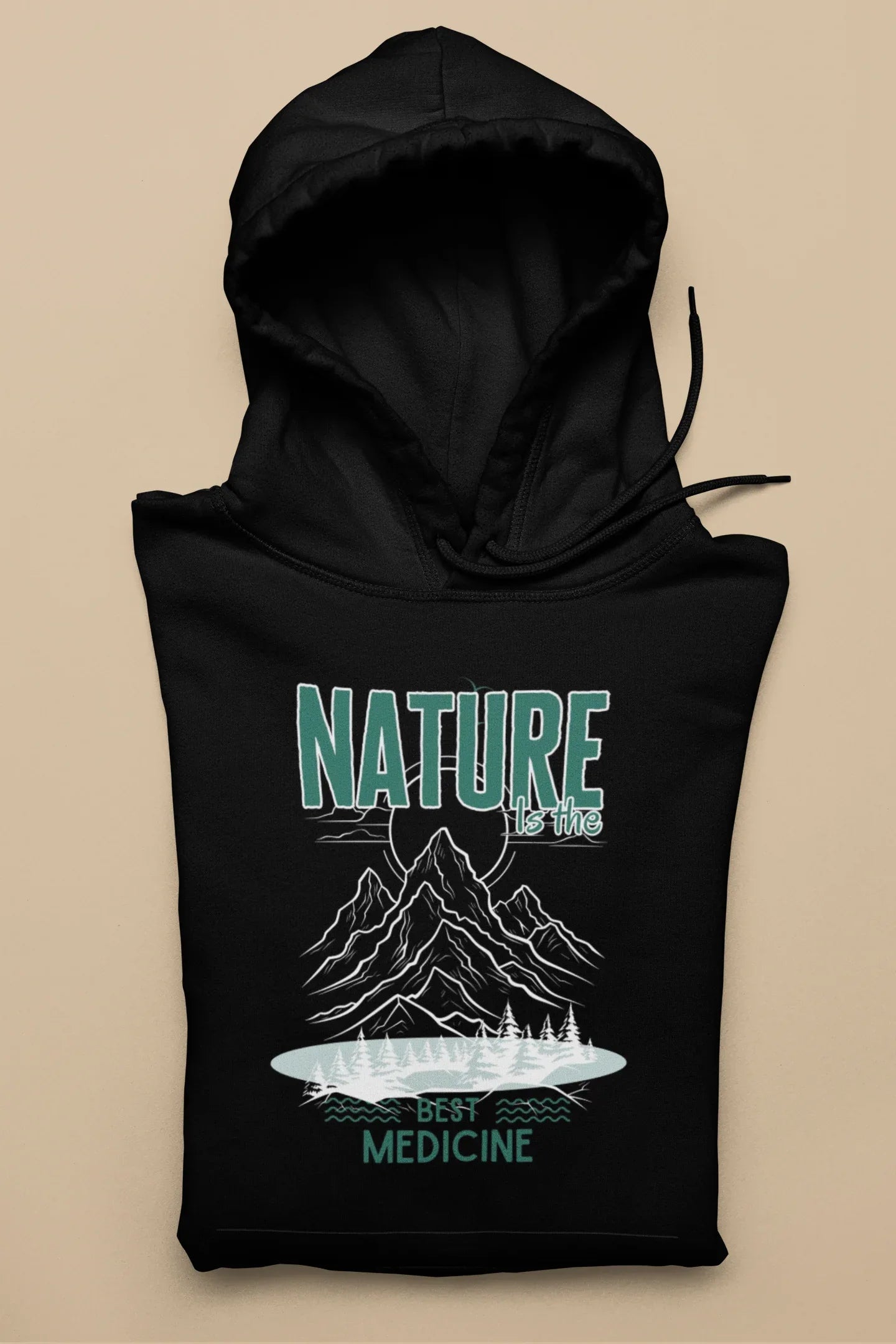 Black pullover hoodie with green “NATURE” and mountain “Best Medicine” graphic.